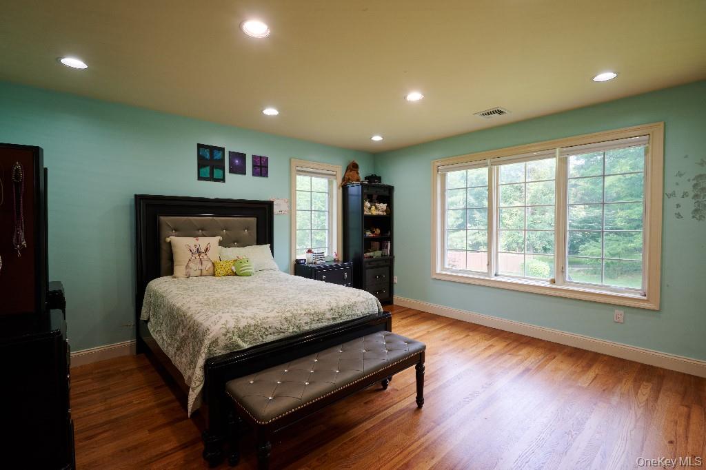 637 South Mountain Road New City, NY 10956 - Photo 30 of 36 a bed sitting in a spacious bedroom next to a window