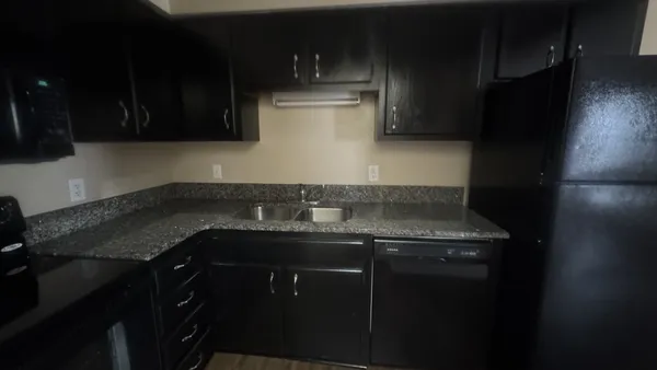 a kitchen with a sink and cabinets
