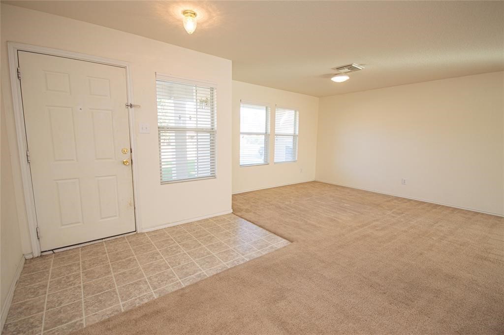 310 Falling Pine Drive Conroe, TX 77304 - Photo 2 of 15 an empty room with windows