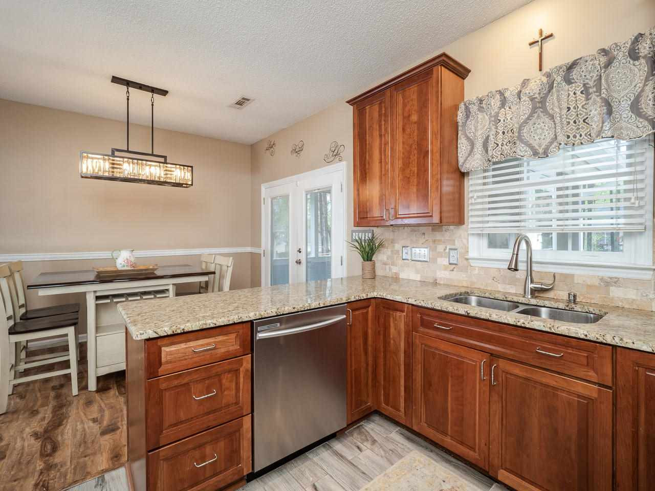 8604 Harps Mill Road Raleigh, NC 27615 - Photo 6 of 26 Kitchen overlooks Breakfast Area & Backyard