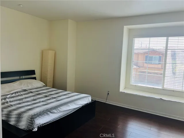 a bathroom with a bathtub a shower a sink and a window