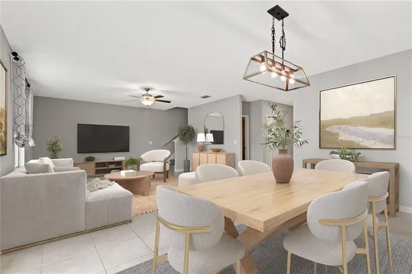 a view of a dining room with furniture wooden floor and chandelier