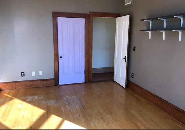 a bathroom with a sink toilet and a mirror