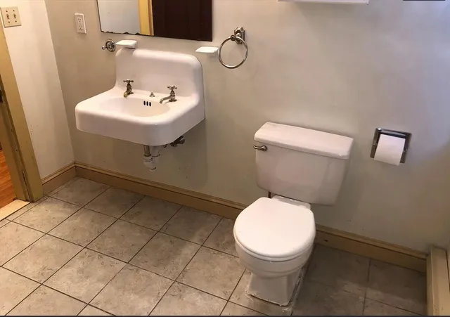 a bathroom with a bathtub and shower