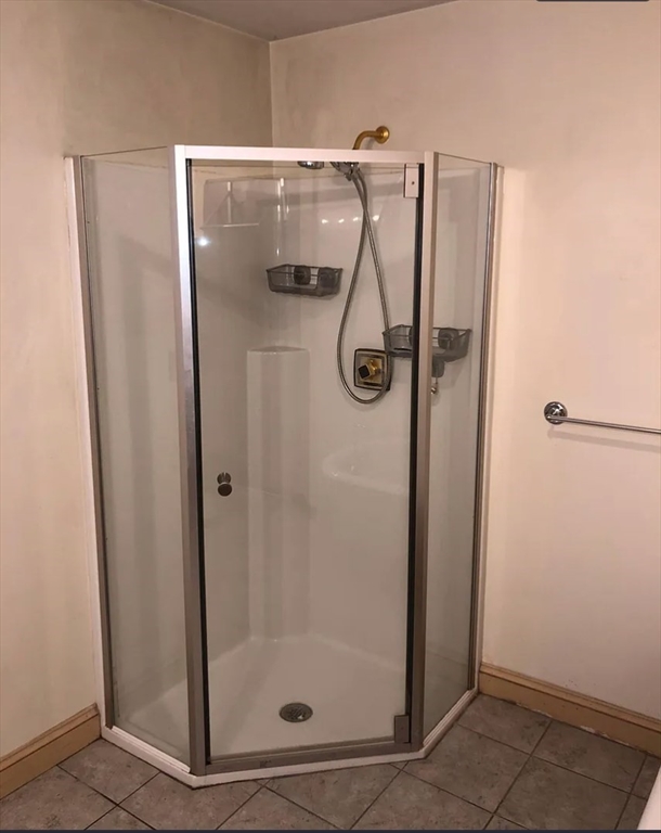 3 Elm Street, Unit 2 Framingham, MA 01701 - Photo 18 of 29 a bathroom with a glass shower door