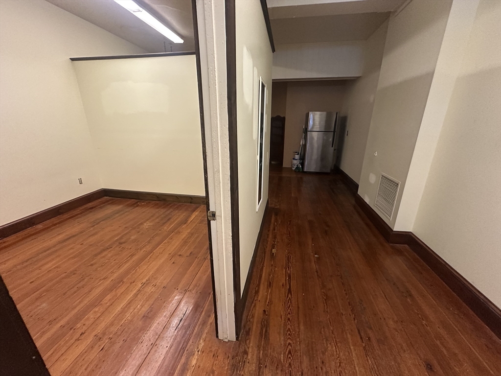 3 Elm Street, Unit 2 Framingham, MA 01701 - Photo 26 of 29 a view of a room with wooden floor