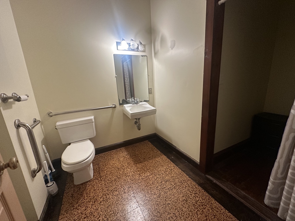 3 Elm Street, Unit 2 Framingham, MA 01701 - Photo 28 of 29 a bathroom with a toilet and a sink