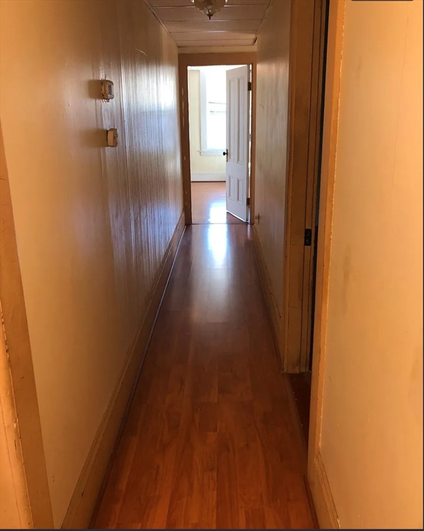 3 Elm Street, Unit 2 Framingham, MA 01701 - Photo 5 of 29 a view of a hallway with wooden floor