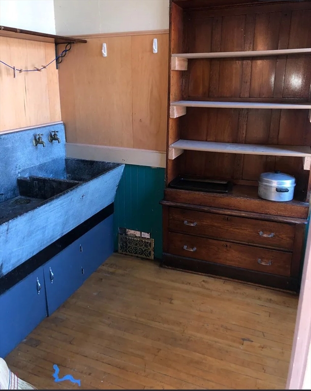 3 Elm Street, Unit 2 Framingham, MA 01701 - Photo 9 of 29 a living room with hard wood floors and a cabinet