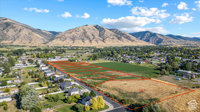 294 West 3400 South, Unit 9 Logan, UT 84321 - Photo 17 of 24 Aerial perspective of suburban area featuring property boundaries highlighted and a mountainous background