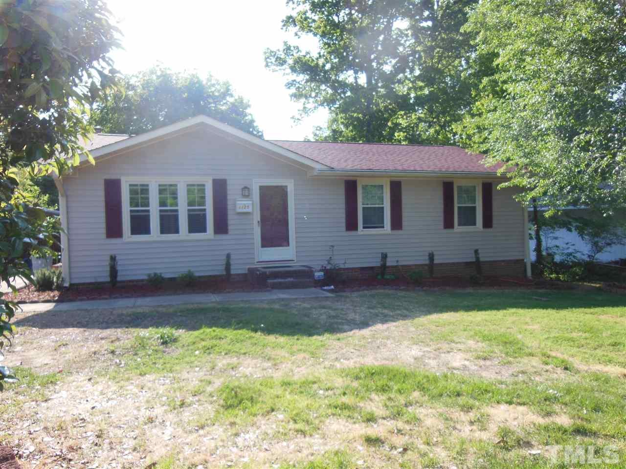 1125 Marlborough Road Raleigh, NC 27610 - Photo 1 of 23 a view of a house with a yard
