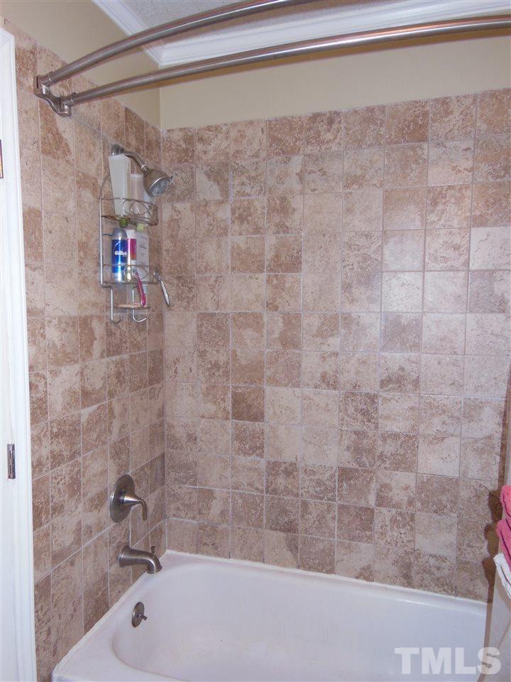 1125 Marlborough Road Raleigh, NC 27610 - Photo 14 of 23 a bathroom with a shower and a bathtub