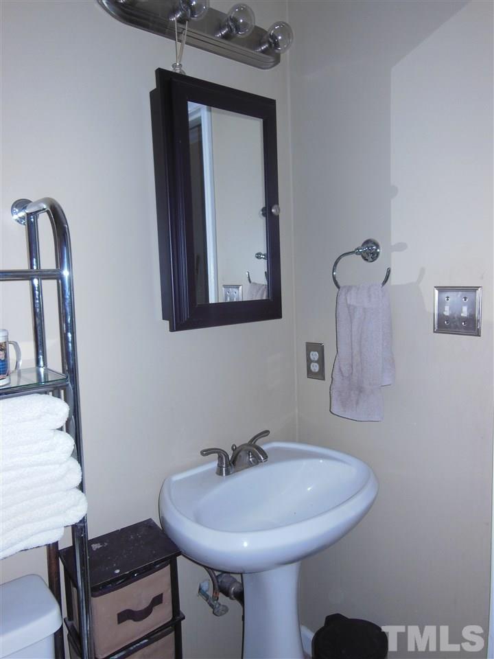 1125 Marlborough Road Raleigh, NC 27610 - Photo 15 of 23 a bathroom with a sink and a mirror