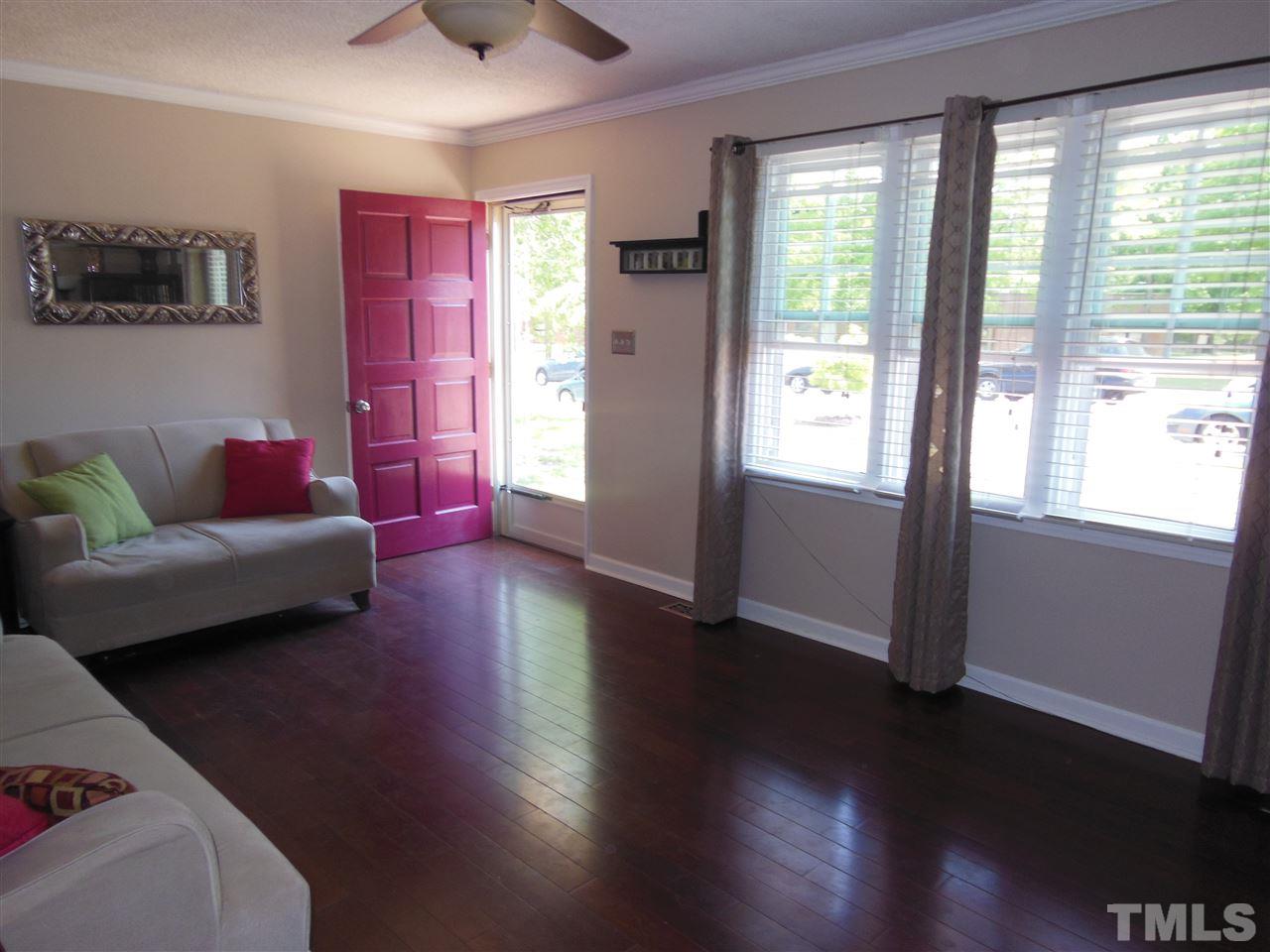 1125 Marlborough Road Raleigh, NC 27610 - Photo 3 of 23 a living room with furniture and a large window