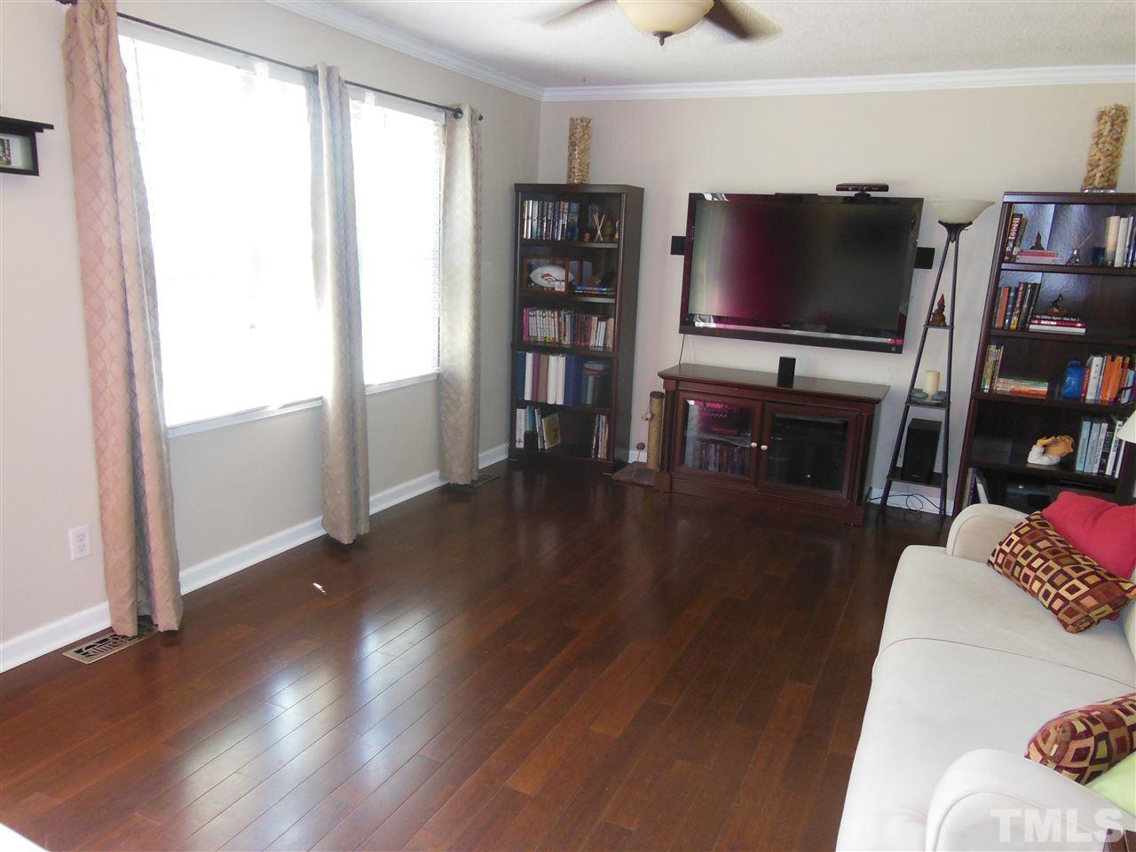 1125 Marlborough Road Raleigh, NC 27610 - Photo 4 of 23 a living room with furniture and a flat screen tv