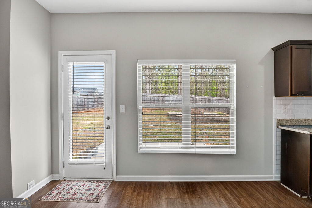 3495 Zaks Way Bethlehem, GA 30620 - Photo 14 of 40 a view of an empty room with a window and wooden floor