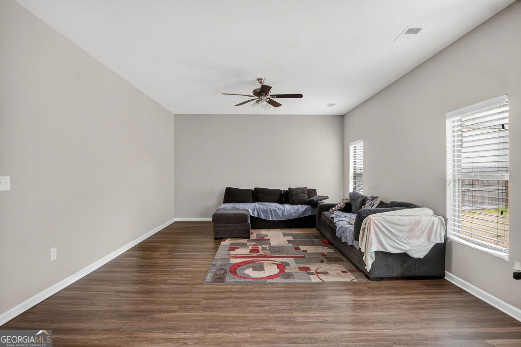 3495 Zaks Way Bethlehem, GA 30620 - Photo 15 of 40 a bedroom with furniture and wooden floor