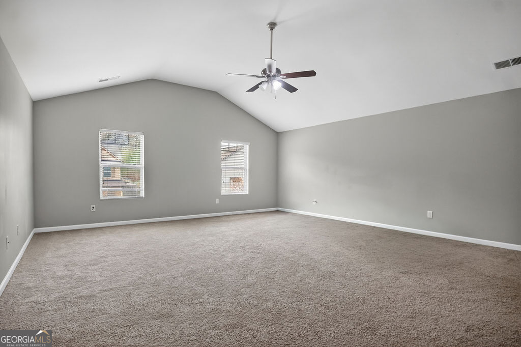 3495 Zaks Way Bethlehem, GA 30620 - Photo 19 of 40 an empty room with windows and fan