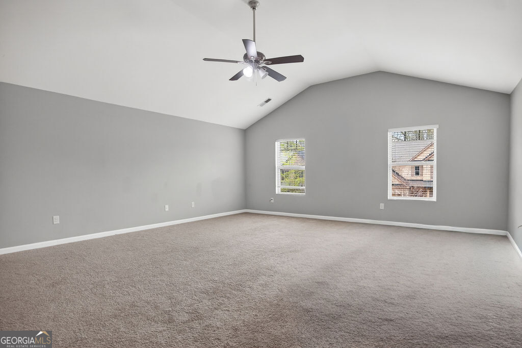 3495 Zaks Way Bethlehem, GA 30620 - Photo 21 of 40 an empty room with windows and fan