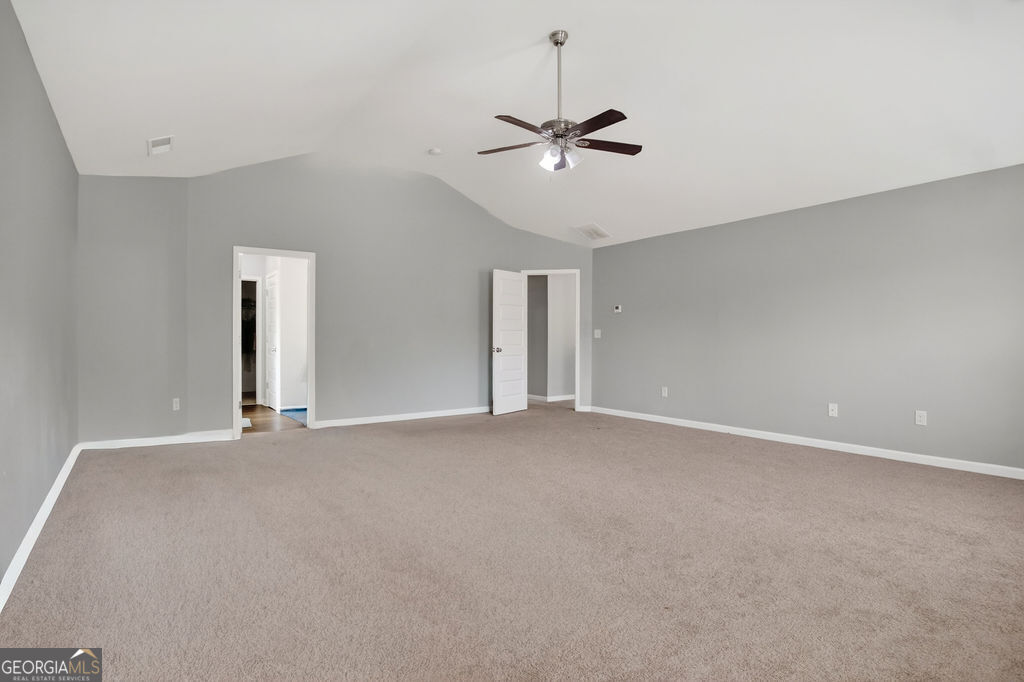 3495 Zaks Way Bethlehem, GA 30620 - Photo 22 of 40 a view of an empty room with a ceiling fan