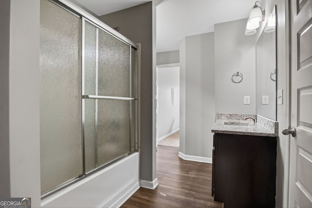 3495 Zaks Way Bethlehem, GA 30620 - Photo 29 of 40 a bathroom with a sink and mirror with toilet