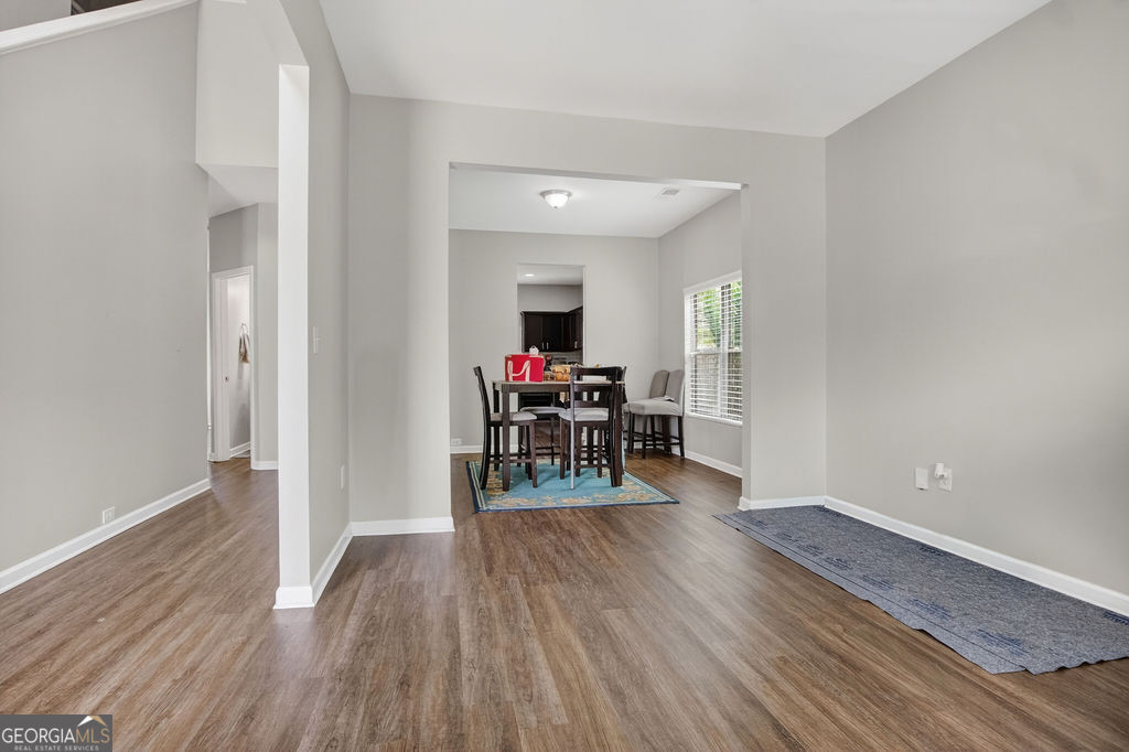 3495 Zaks Way Bethlehem, GA 30620 - Photo 6 of 40 a dining room with furniture and wooden floor