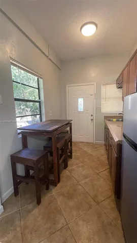 a kitchen with a cabinets and a stove top oven