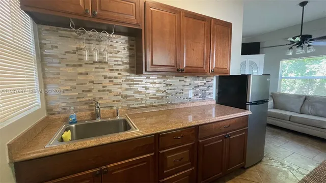 a kitchen with a sink and cabinets