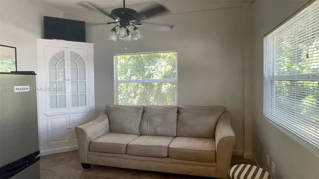 a living room with furniture and a window