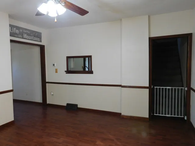 a view of a livingroom with wooden floor