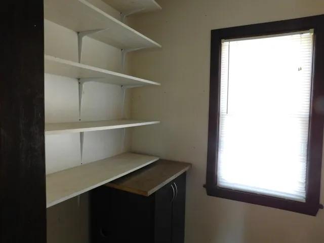 a hallway with cabinets