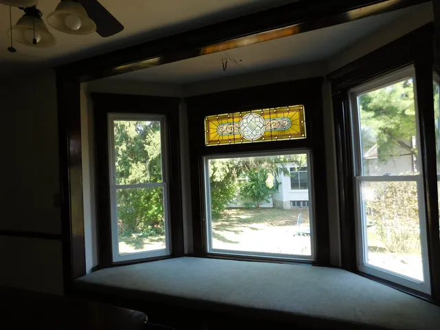 a view of an empty room with a window