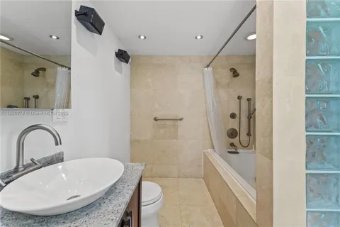 a bathroom with a sink and mirror