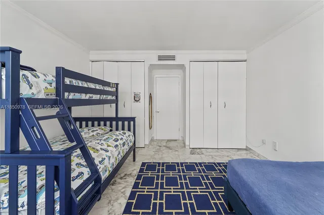 a view of a hallway with wooden floor and stairs