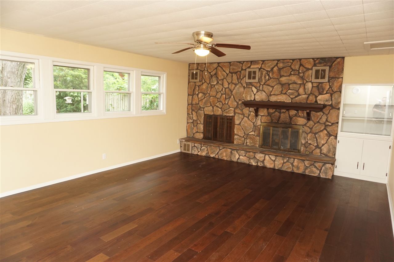 7908 Randy Road Machesney Park, IL 61115 - Photo 4 of 16 a view of a fireplace in wooden floor