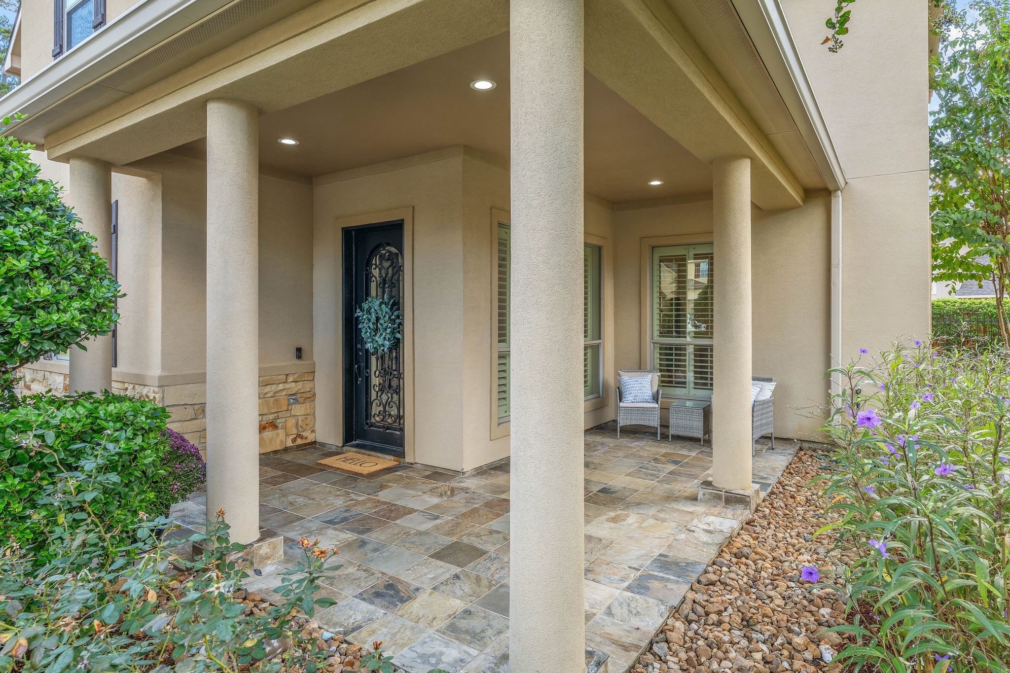 7603 Hogan Bridge Court Spring, TX 77389 - Photo 2 of 50 Welcoming, spacious patio featuring a Wrought iron entry door featuring an interior-opening glass insert.