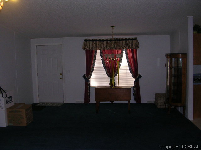 1239 Tabernacle Road Mathews, VA 23109 - Photo 19 of 22 a room with wooden floor and window