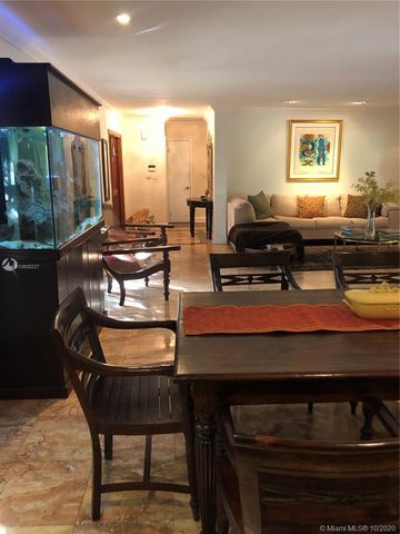 a living room with furniture a rug and a window