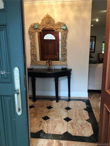 a bathroom with a sink a mirror and vanity