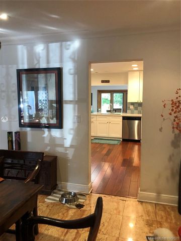 a kitchen with a sink and a stove top oven