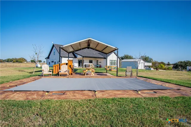 a view of big yard with large trees