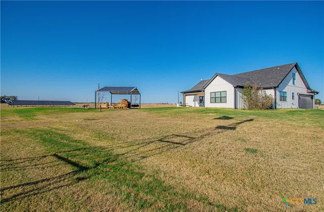 a house with pool and a yard