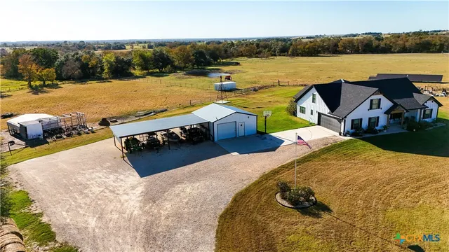 a view of swimming pool with outdoor seating and yard in back