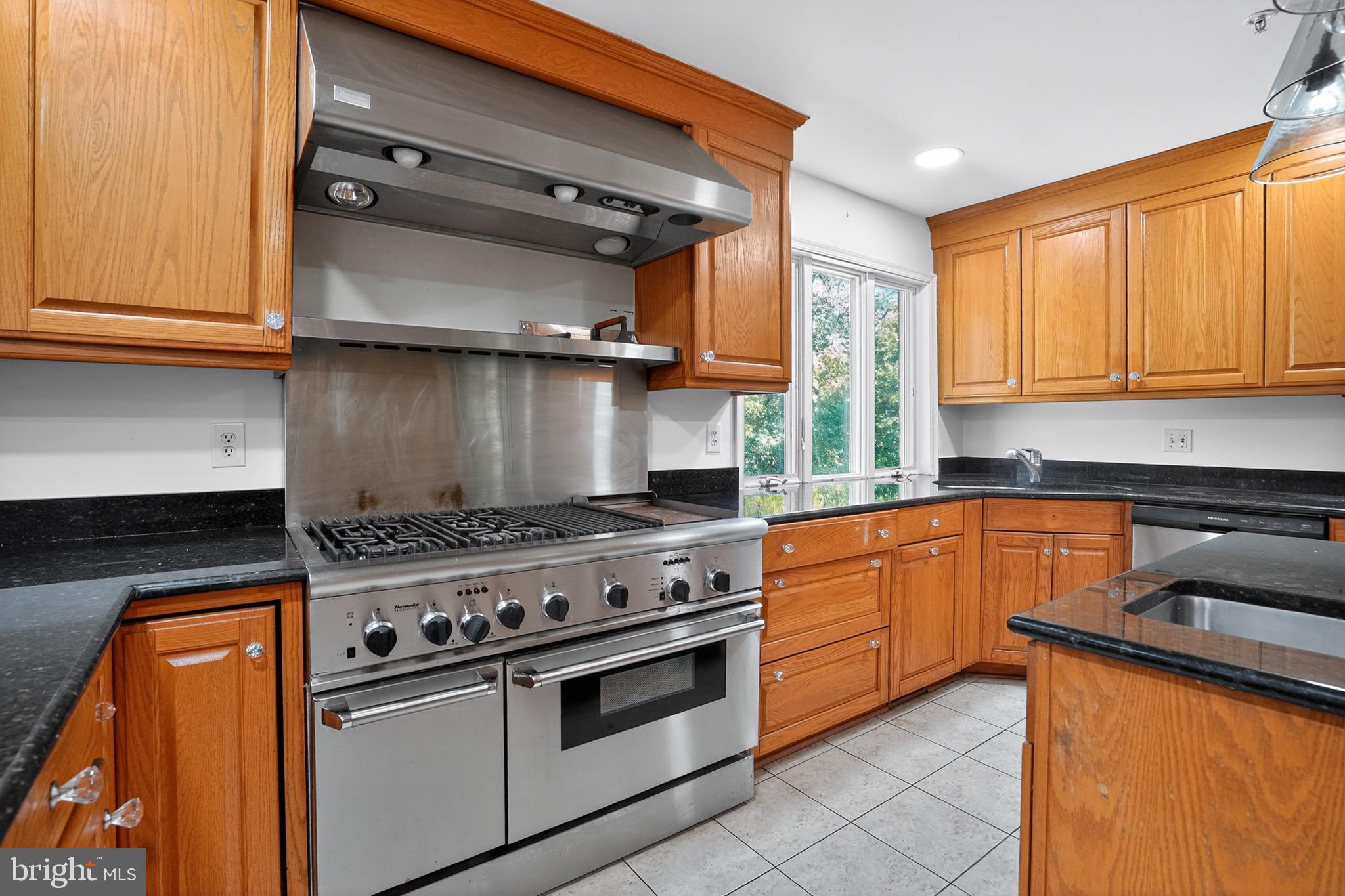 11308 Chantilly Lane Bowie, MD 20721 - Photo 14 of 30 a kitchen with stainless steel appliances granite countertop a stove and a sink