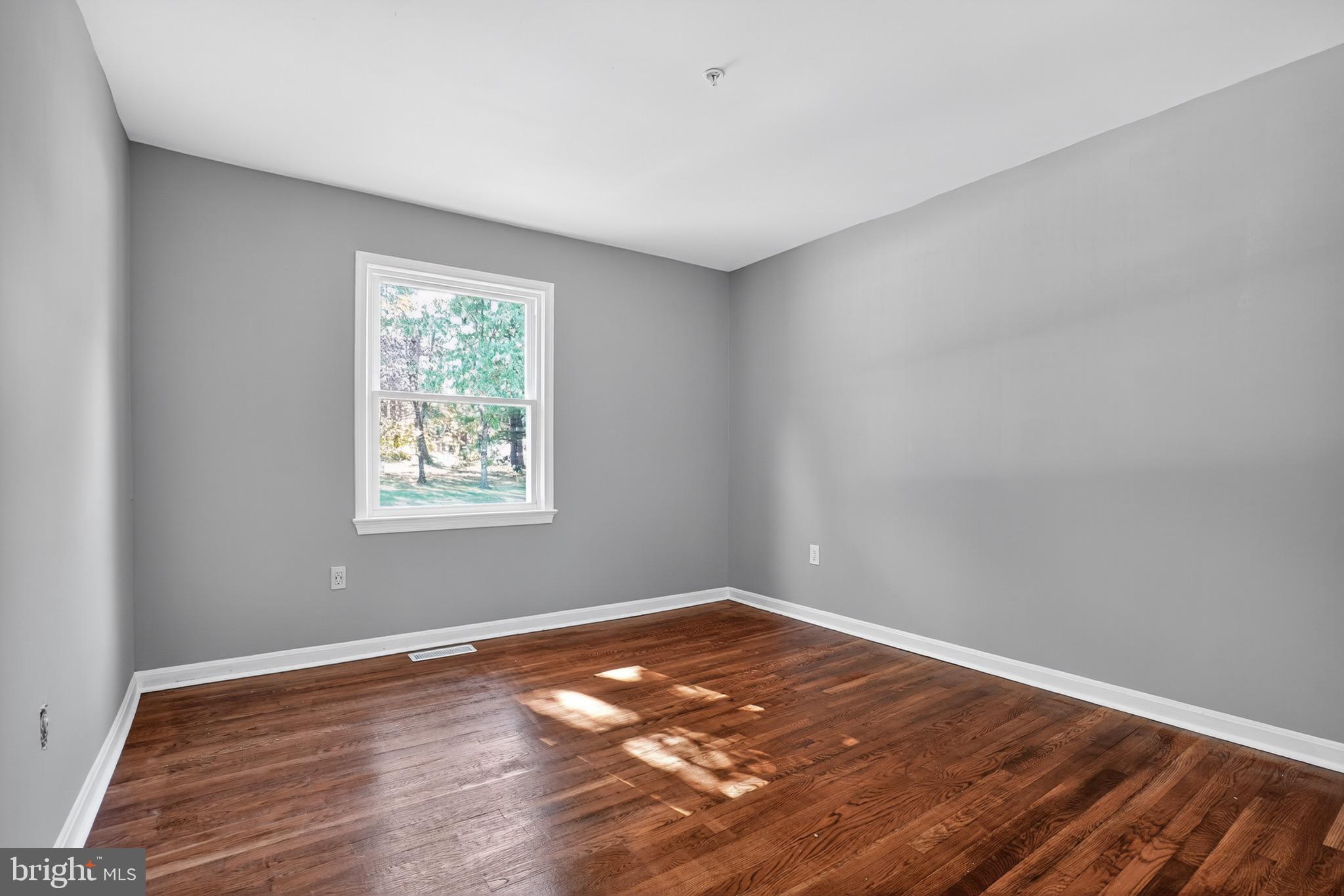 11308 Chantilly Lane Bowie, MD 20721 - Photo 20 of 30 wooden floor in an empty room with a window