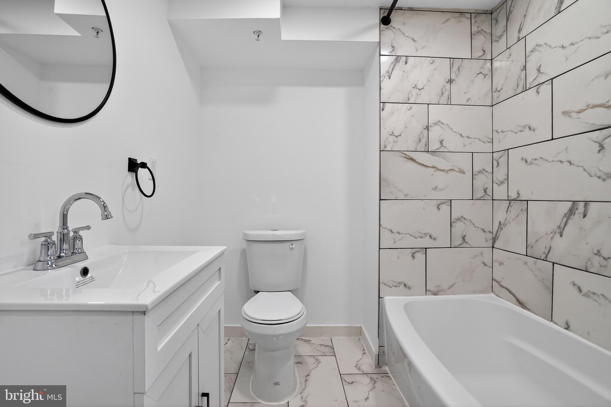 11308 Chantilly Lane Bowie, MD 20721 - Photo 3 of 30 a bathroom with a toilet and a sink