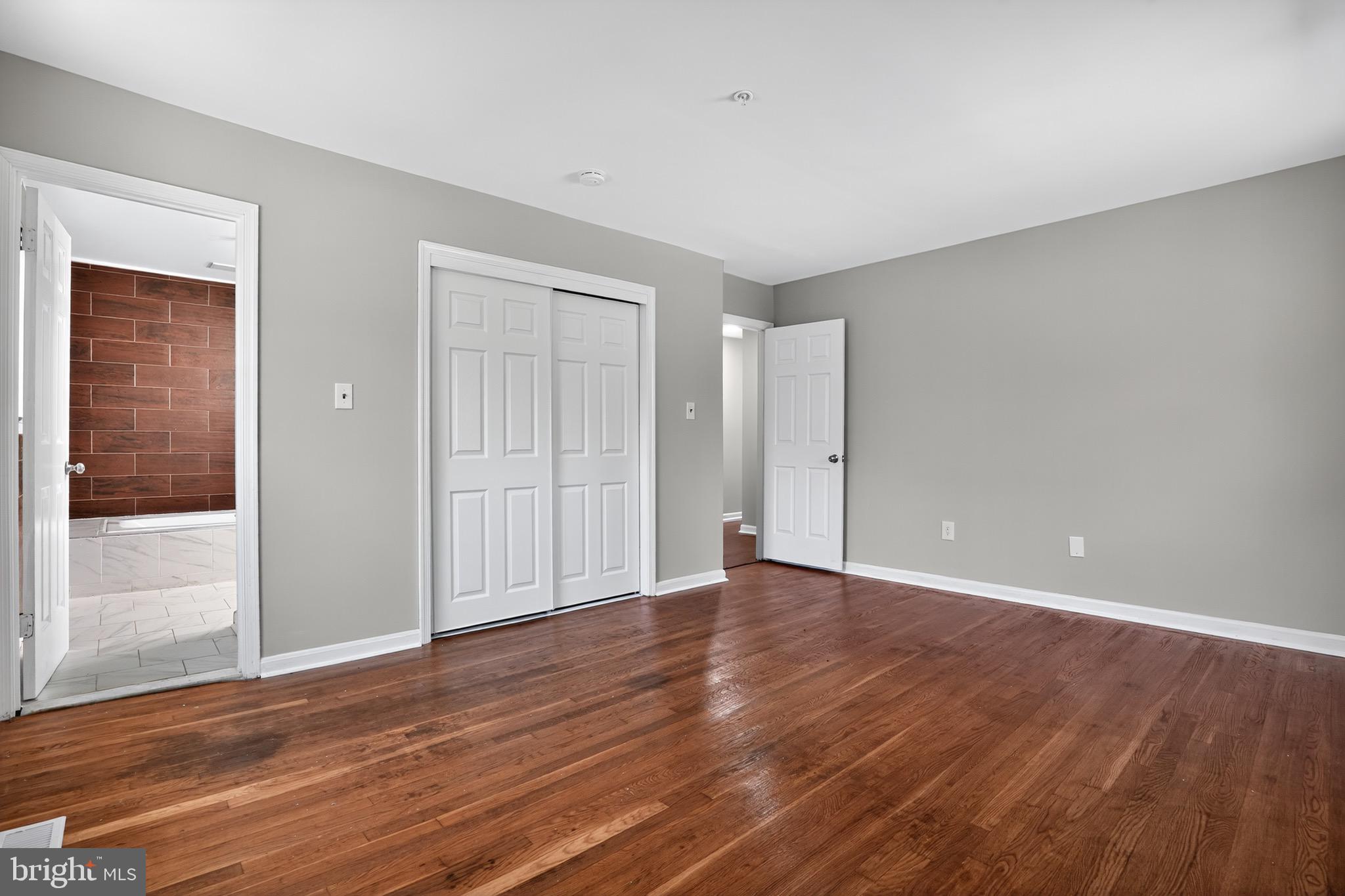 11308 Chantilly Lane Bowie, MD 20721 - Photo 7 of 30 a view of an empty room with wooden floor