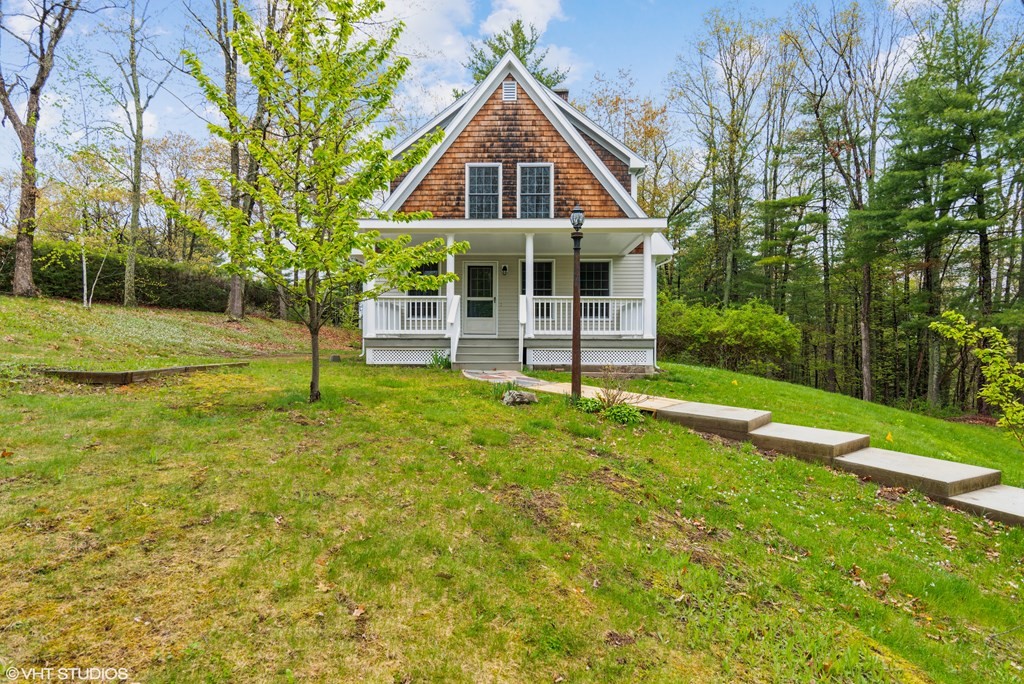 a front view of a house with a yard
