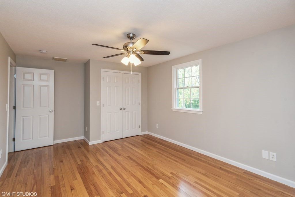 106 Martin Farms Road Hampden, MA 01036 - Photo 28 of 34 a view of an empty room with wooden floor and a window