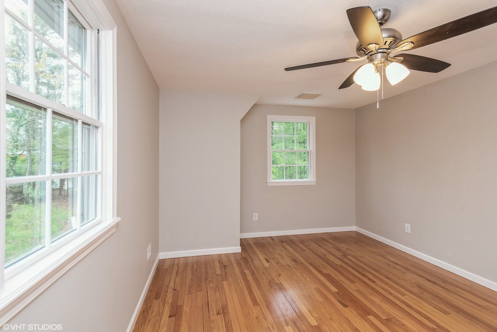 106 Martin Farms Road Hampden, MA 01036 - Photo 29 of 34 a view of an empty room with wooden floor and a window